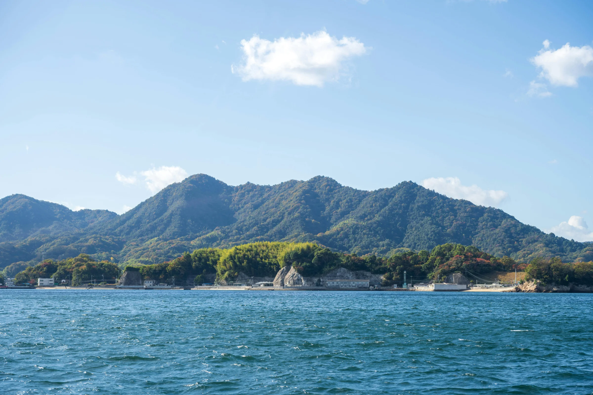 Wide hero view of Naoshima’s coastal scenery with art-island atmosphere in Japan