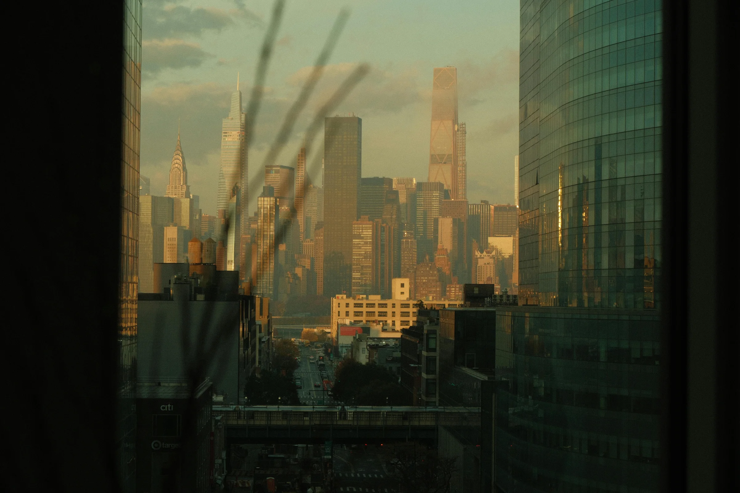 Golden hour view of the New York City skyline with iconic skyscrapers