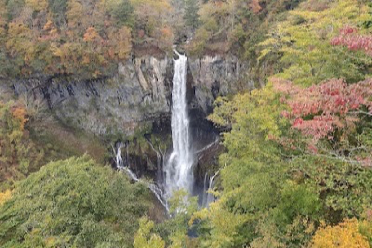 Kegon Falls plunging into a misty basin in Oku-Nikko