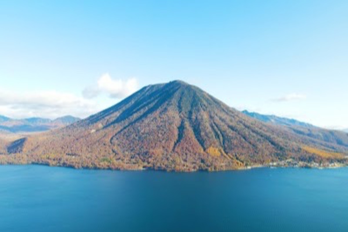 Lake Chuzenji reflecting Mt. Nantai on a clear autumn afternoon