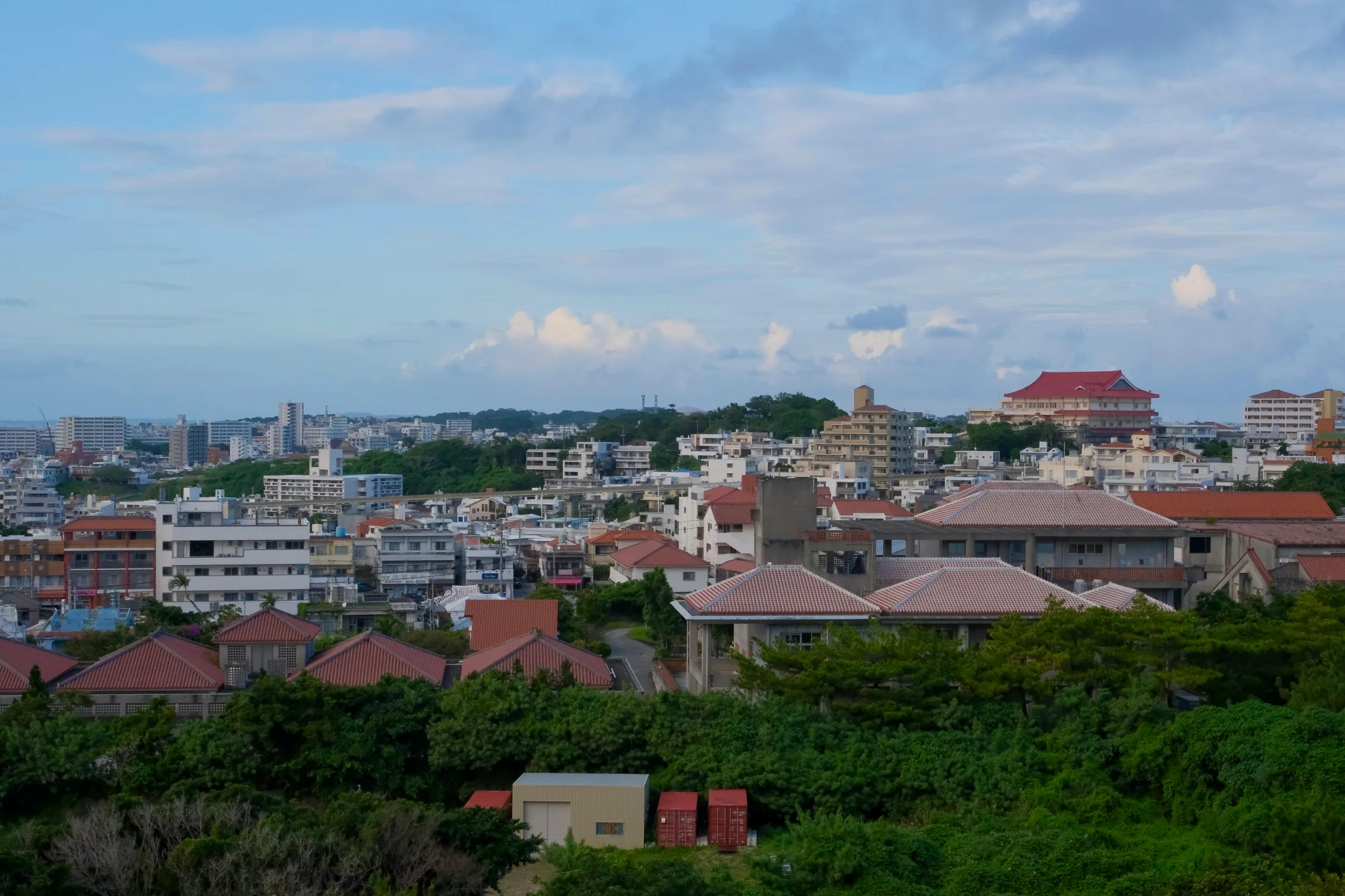 Sunset cityscape of Naha, Okinawa with coastline and skyline