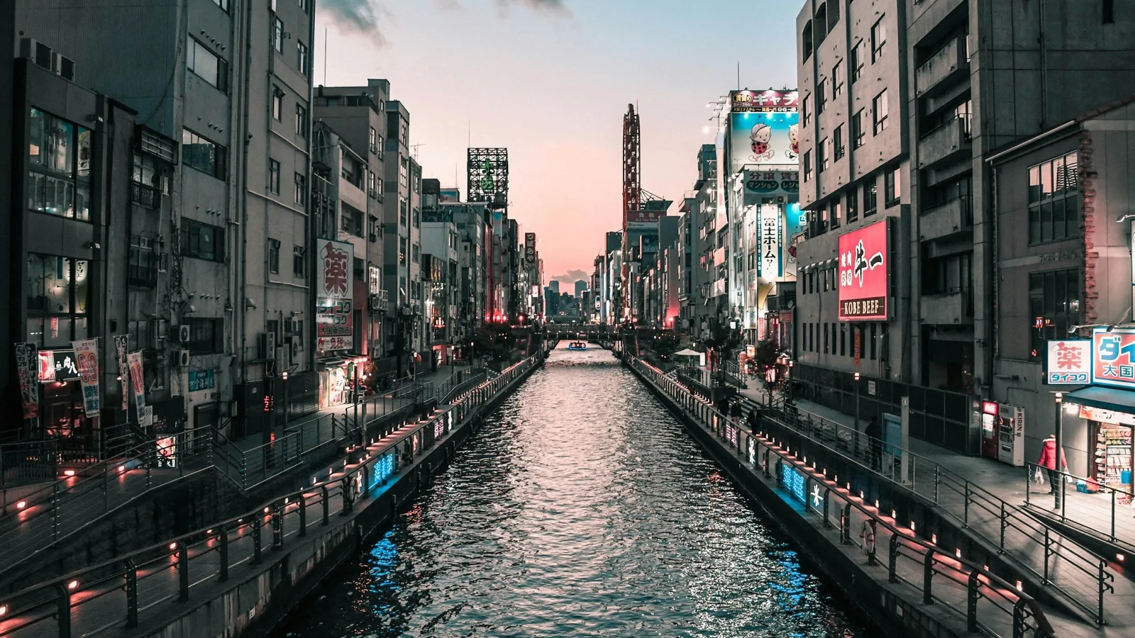Dotonbori neon signs reflected along the canal at night in Osaka, Japan