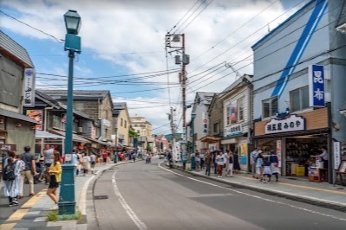 Sakaimachi Shopping Street with preserved Meiji-era merchant facades and glass shop displays
