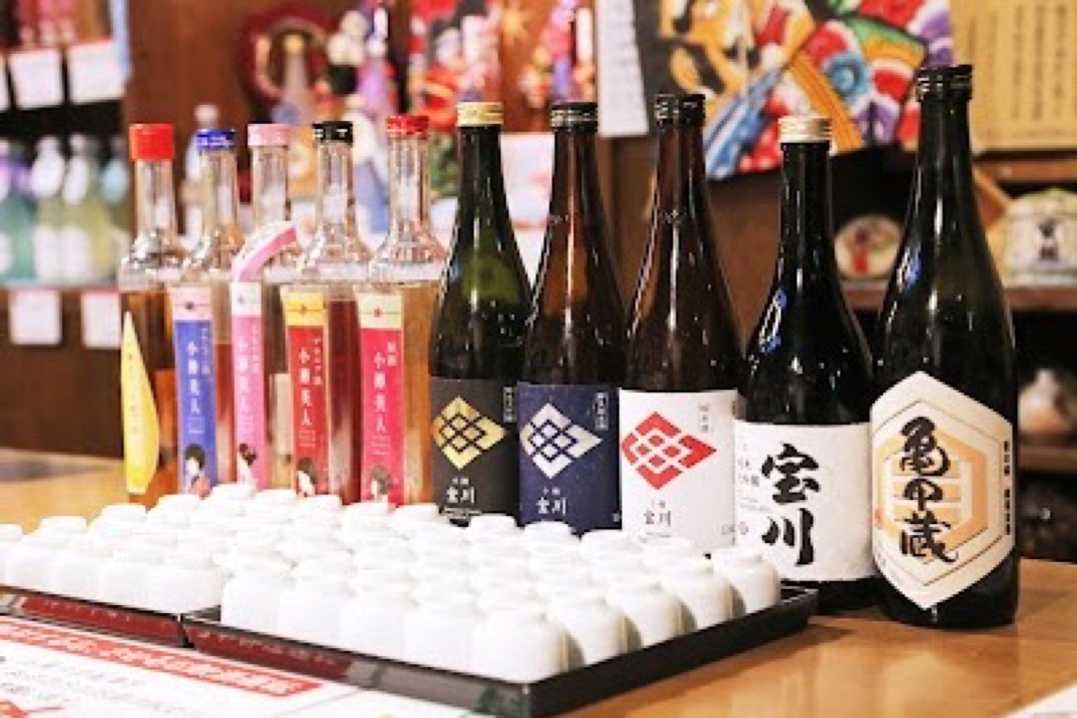 Tanaka Sake Brewery wooden brewing hall with traditional sake tanks in Otaru