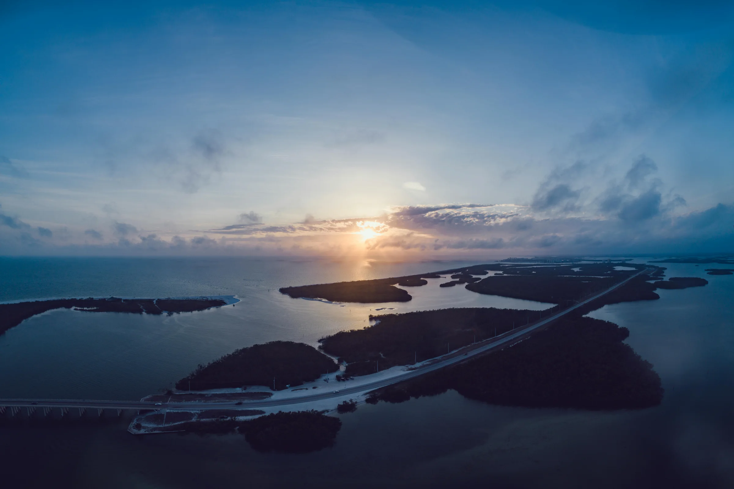 Aerial sunset view of Pensacola Beach coastline in Florida