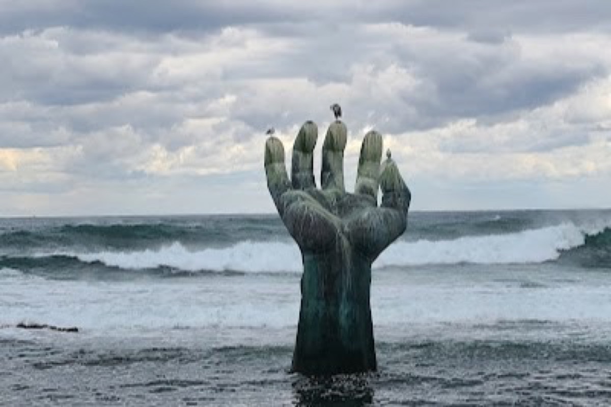 Hand of Harmony bronze hands reaching across Homigot tidal flats in Pohang