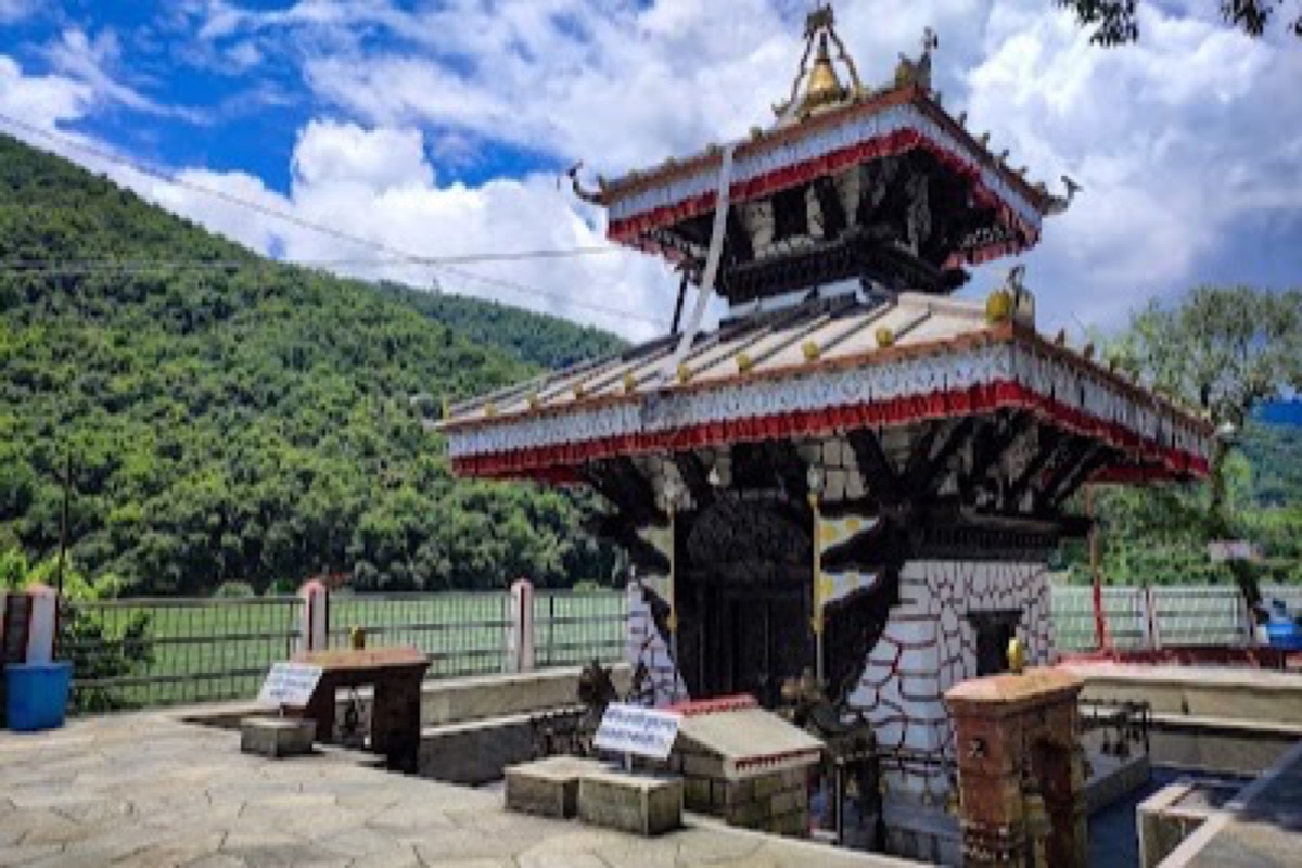 Tal Barahi's two-story pagoda temple on its island in Phewa Lake at dawn