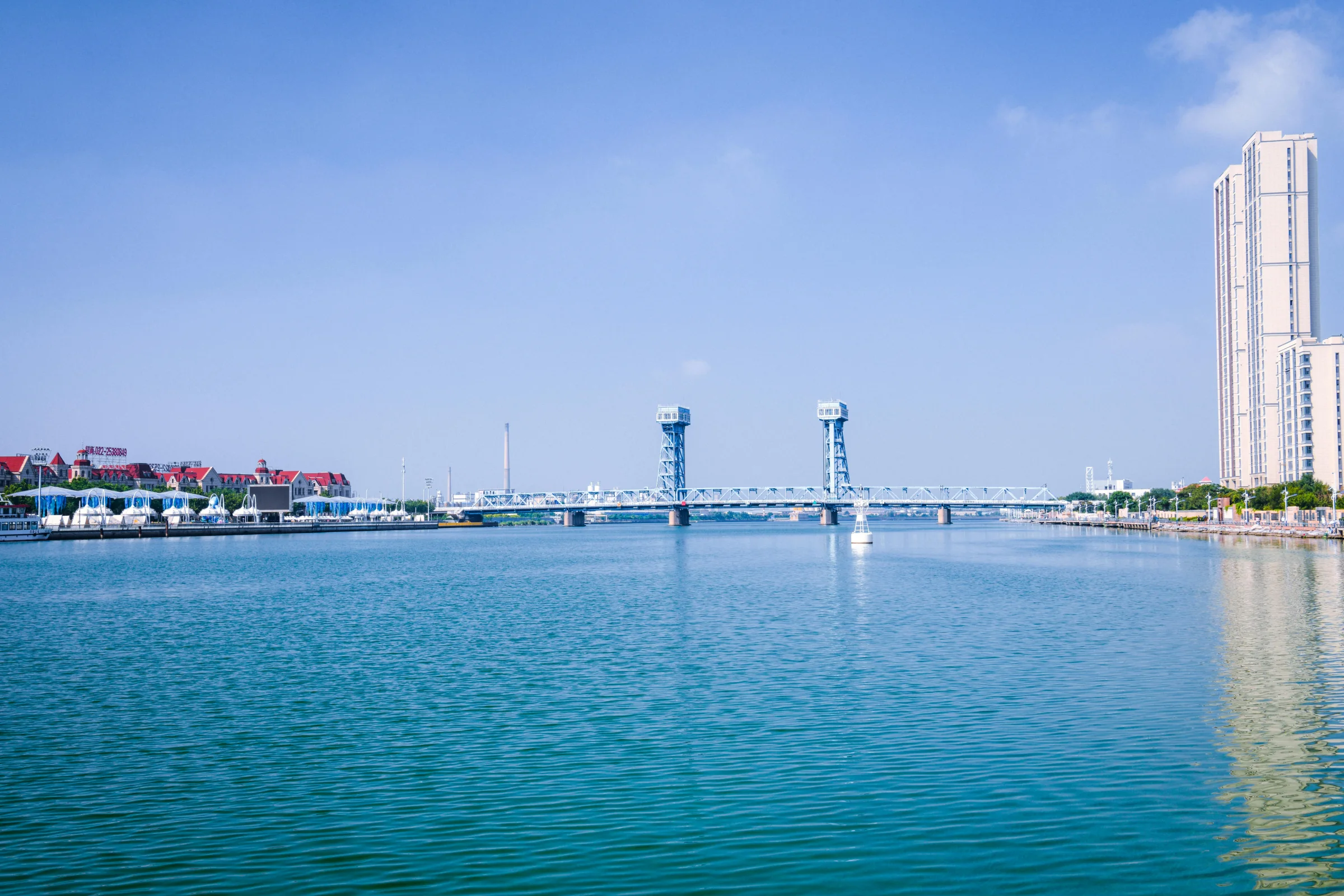 Sunset view of Qingdao waterfront skyline with modern buildings and coastline in China
