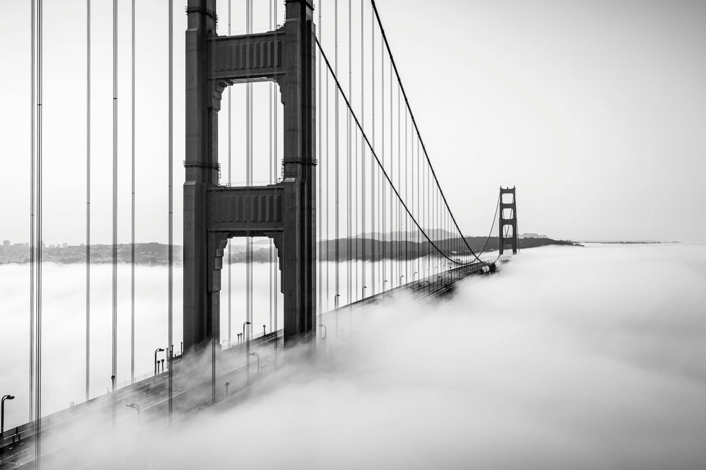 Golden Gate Bridge with the San Francisco skyline and waterfront at sunset