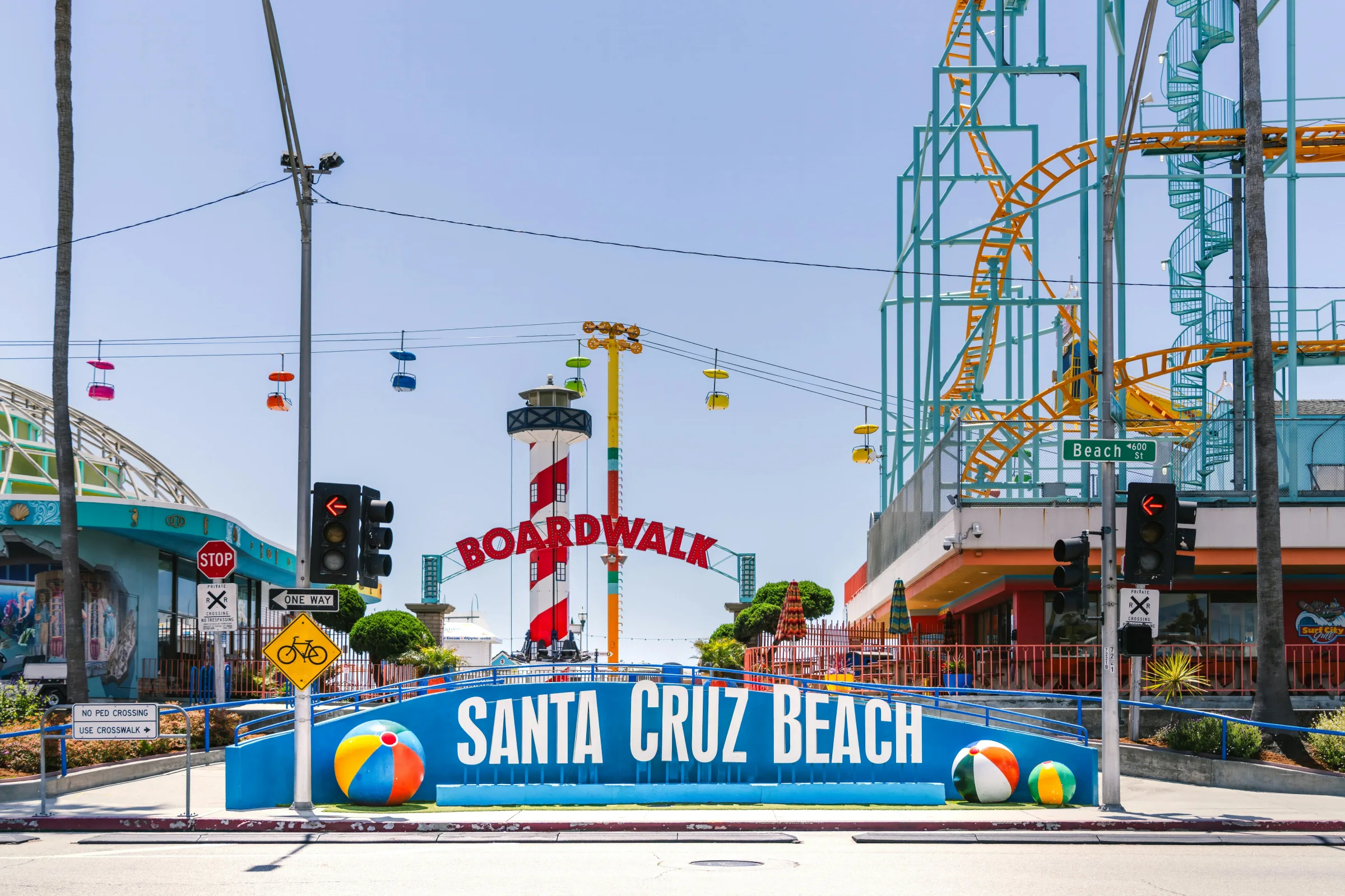 Aerial sunset view of Santa Cruz Beach Boardwalk and coastline in California