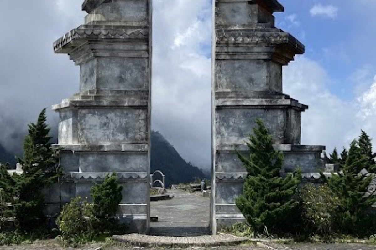 Windy viewpoint over hairpin bends and the flanks of Fansipan at Tram Ton Pass near Sapa