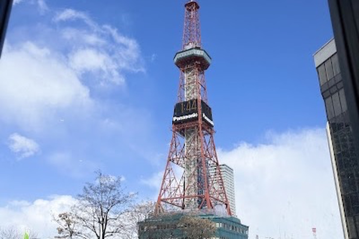 Sapporo TV Tower observation deck at dusk overlooking snow-covered Odori Park