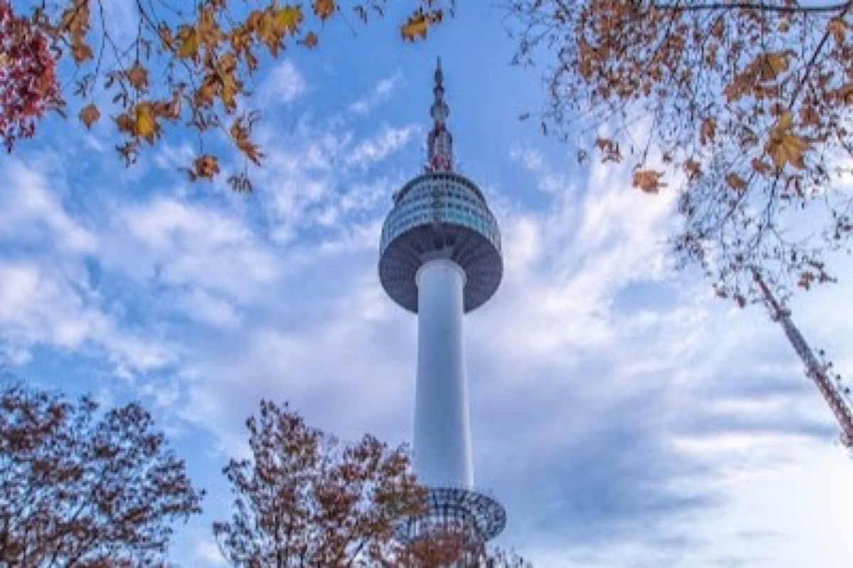 N Seoul Tower at sunset with panoramic Seoul skyline views from Namsan Mountain