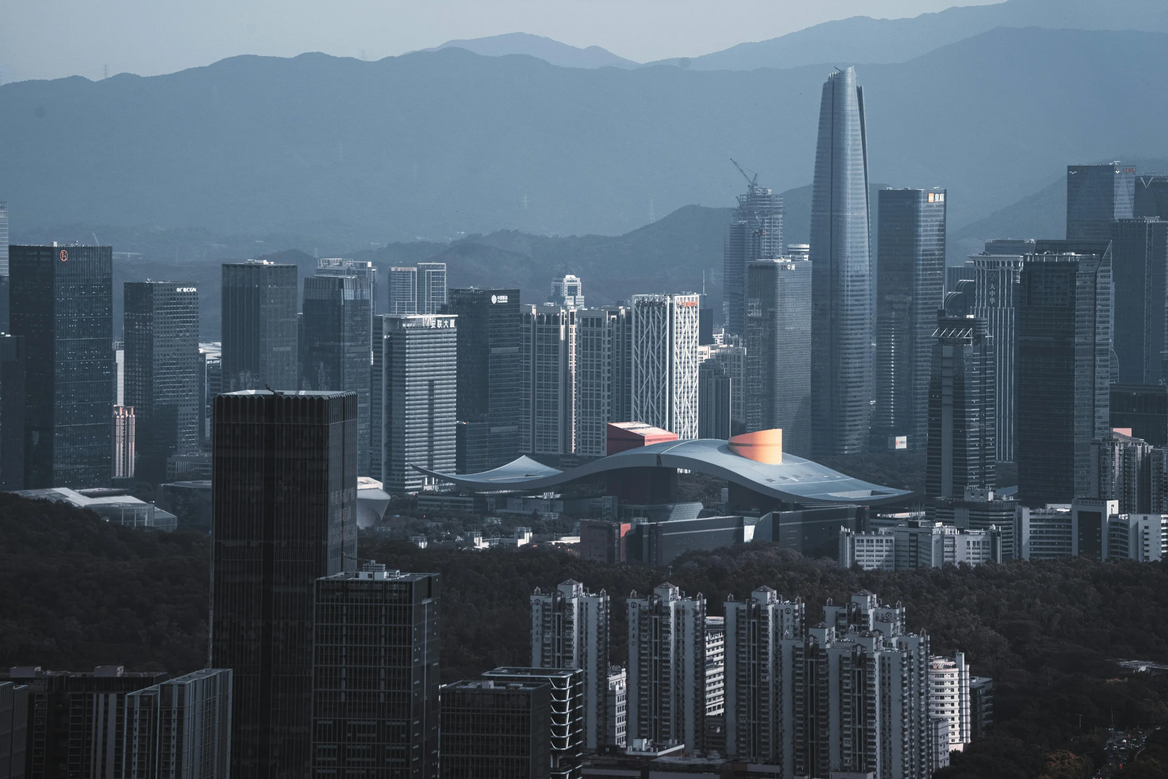 Shenzhen skyline at dusk with modern skyscrapers and waterfront lights
