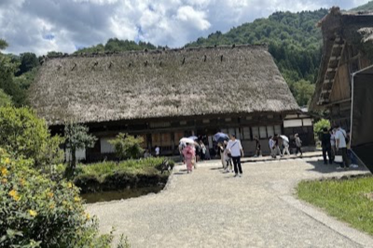 Wada House gassho-zukuri farmhouse interior with steep thatched roof beams in Shirakawa-go
