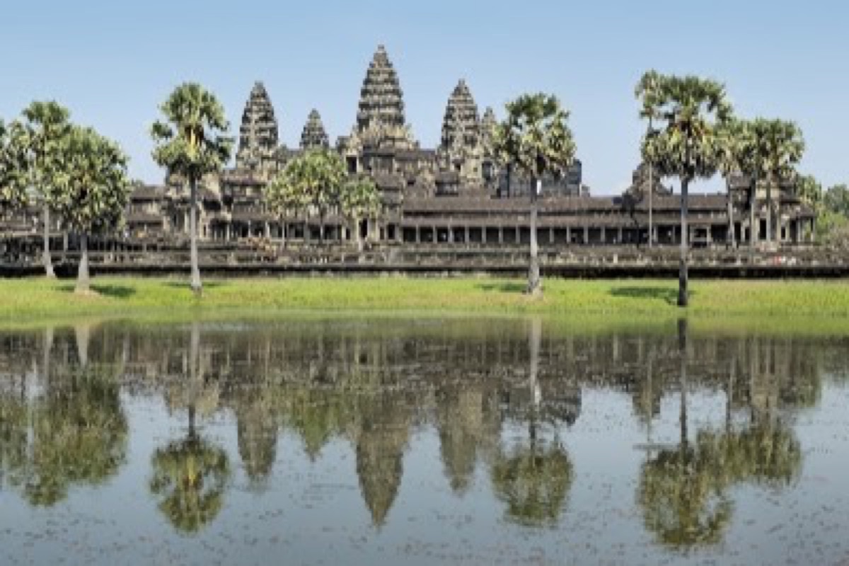 Angkor Wat towers reflected in the pond at dawn in Siem Reap