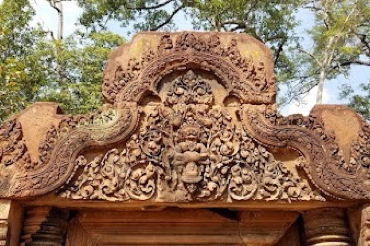 Intricate pink sandstone bas-reliefs at Banteay Srei citadel of women