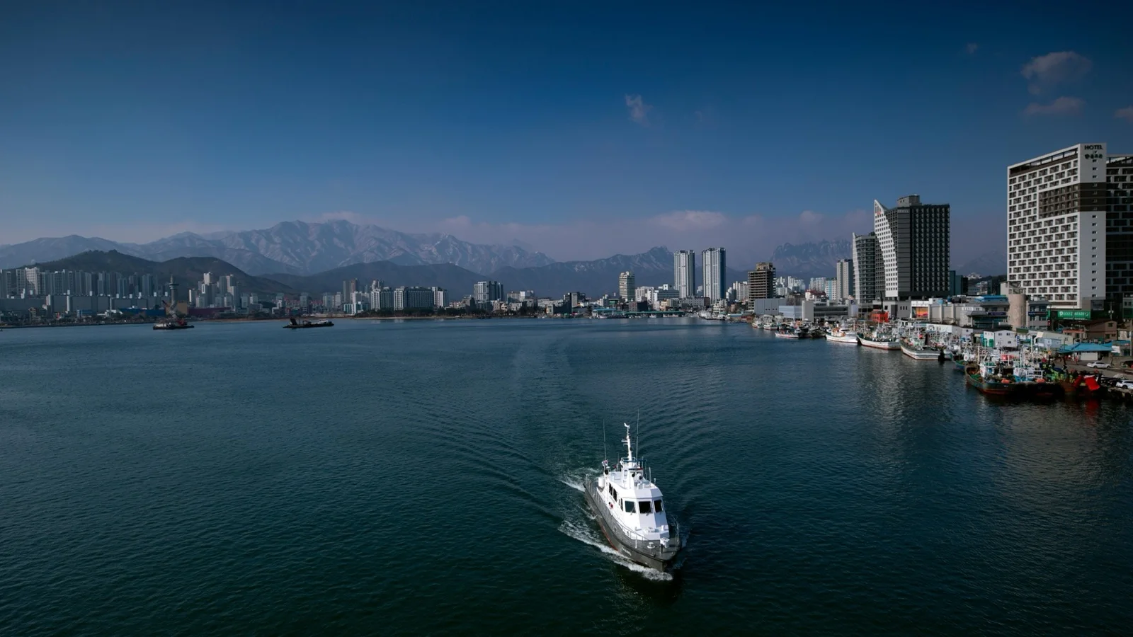 Seoraksan National Park granite peaks rising above forested valleys with the East Sea visible in the distance near Sokcho