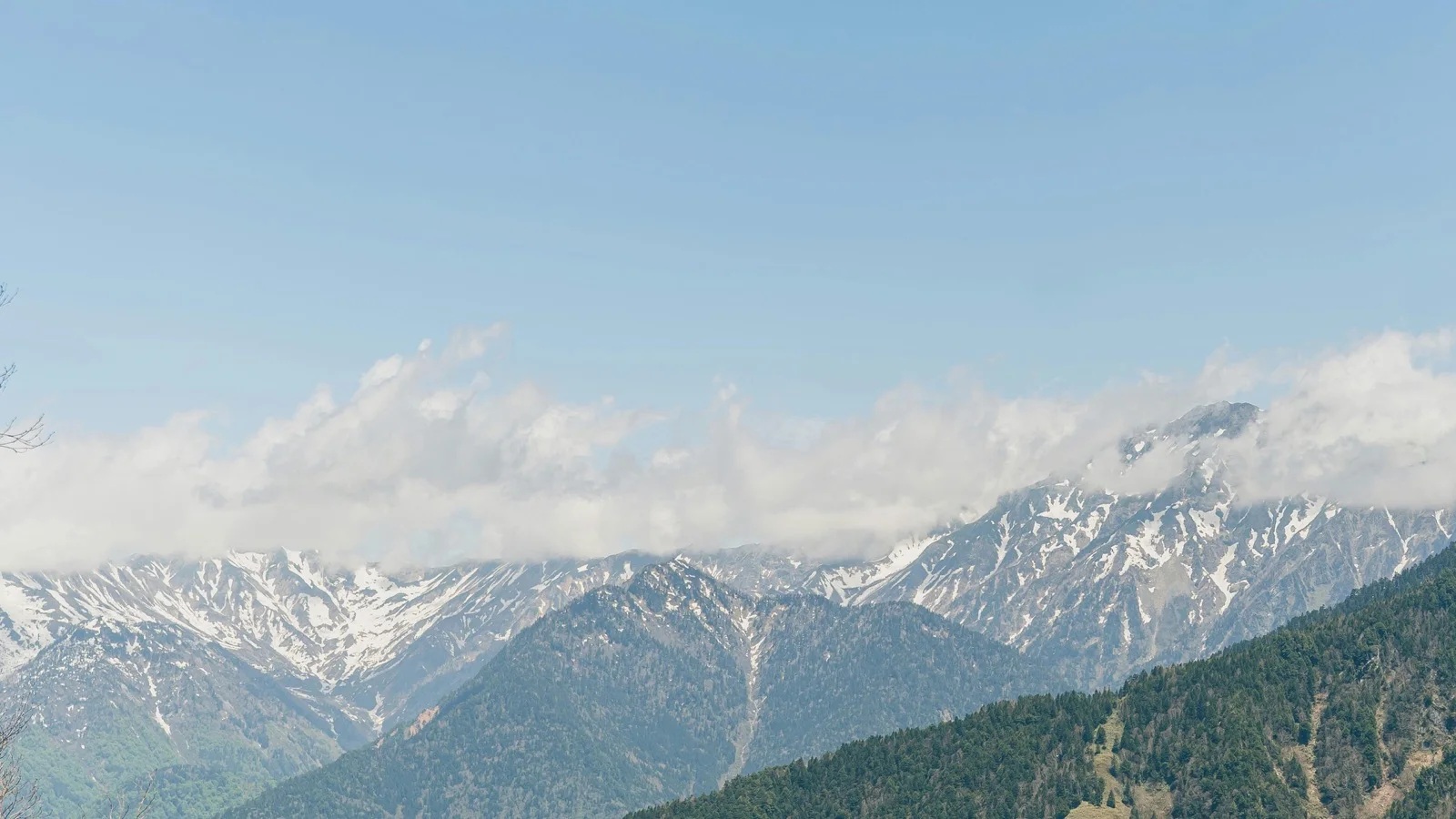 Traditional wooden merchant houses lining a narrow lane in Sanmachi Suji, Takayama