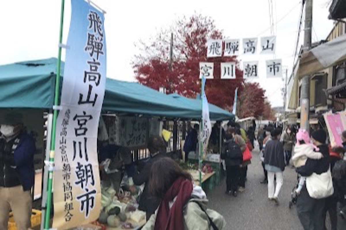 Miyagawa Morning Market stalls along the riverbank in Takayama at dawn
