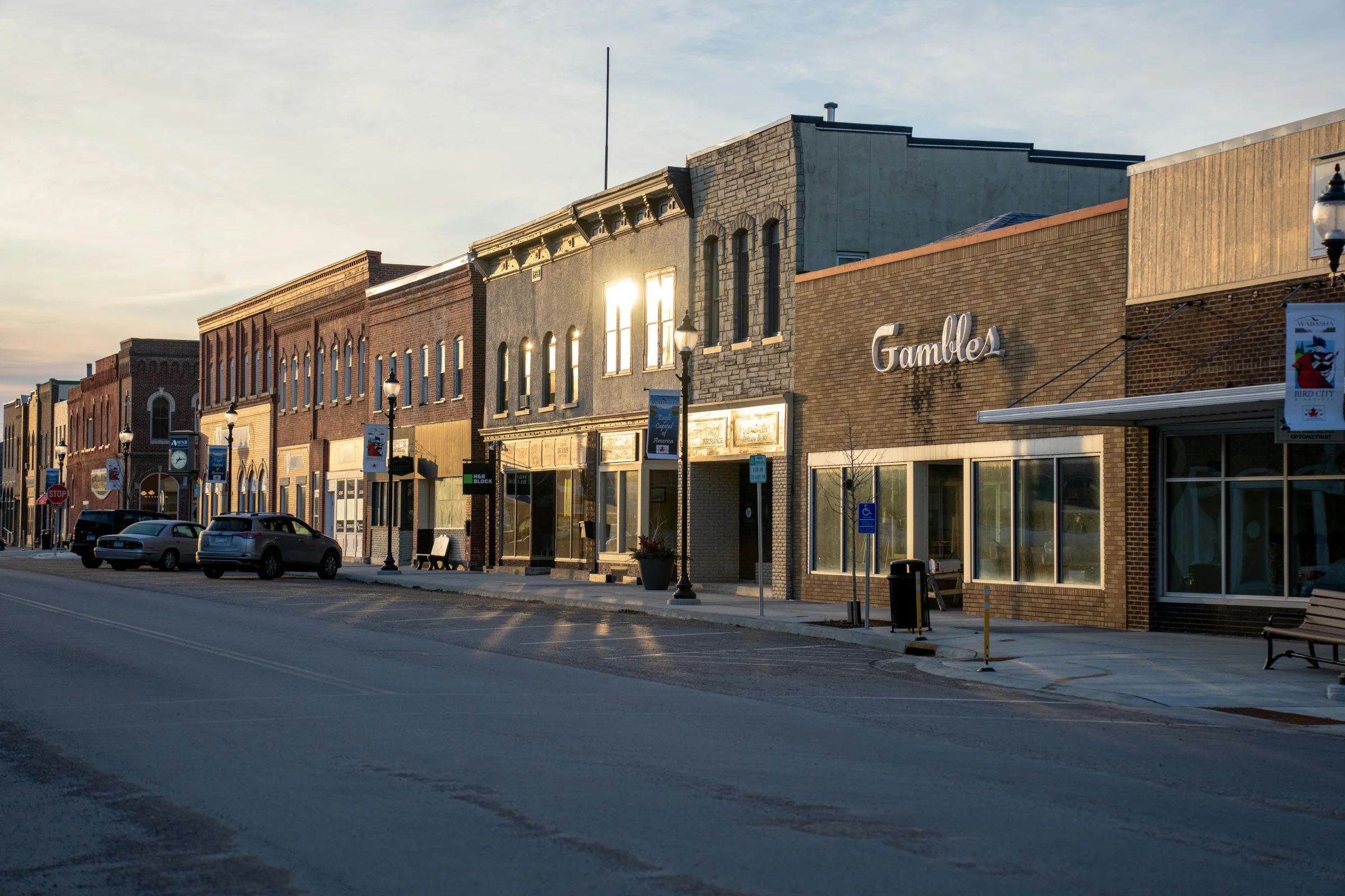 Sunset view over a Texas Hill Country small town main street and surrounding rolling hills