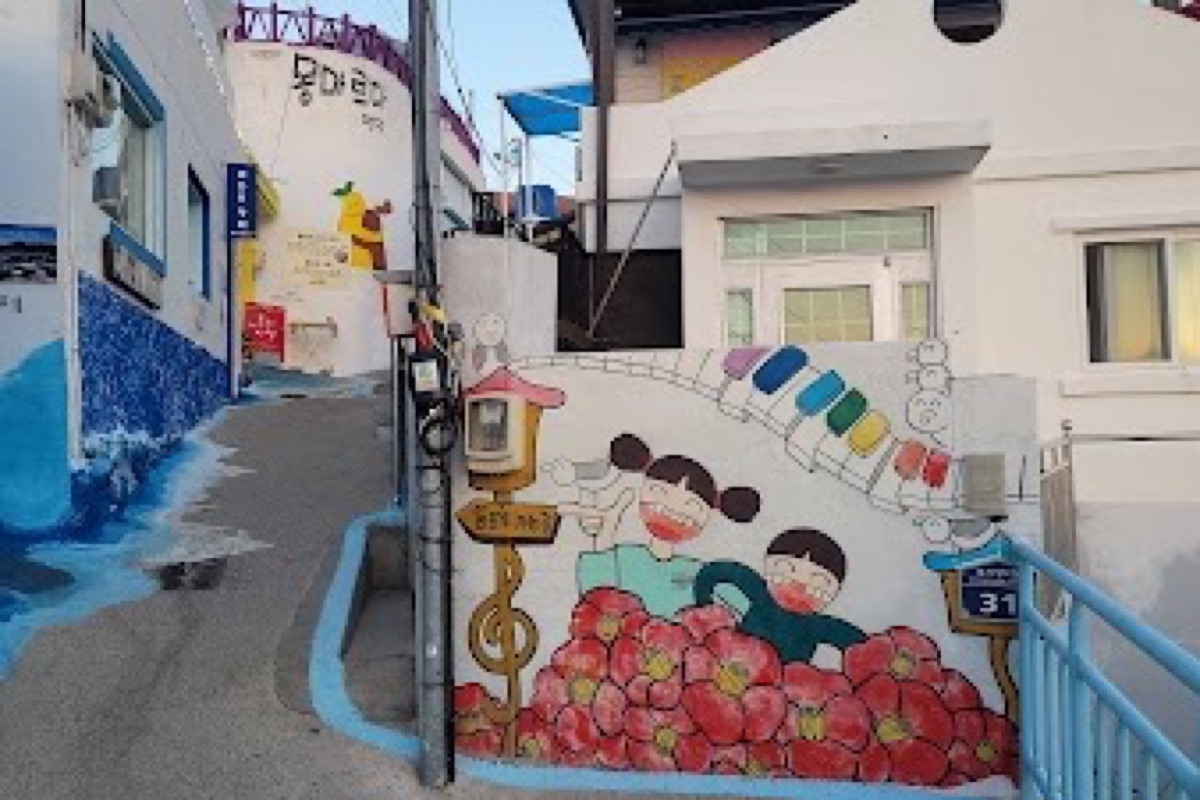 Dongpirang Mural Village colorful painted walls and steep stairways overlooking Gangguan Port in Tongyeong