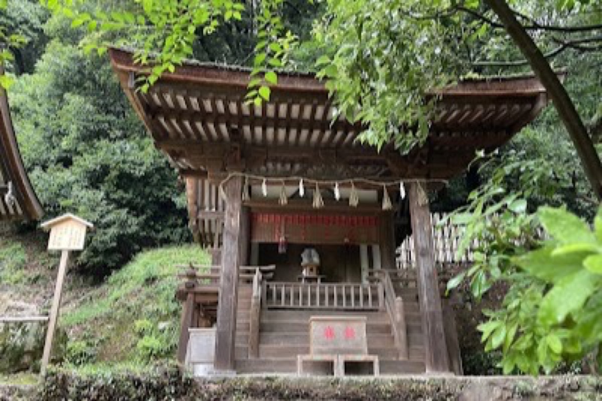 Ujigami Shrine nestled in lush green forested hills above the Uji River