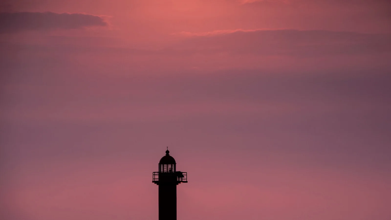 Ganjeolgot Cape lighthouse above the East Sea at sunrise with rapeseed flower fields in Ulsan