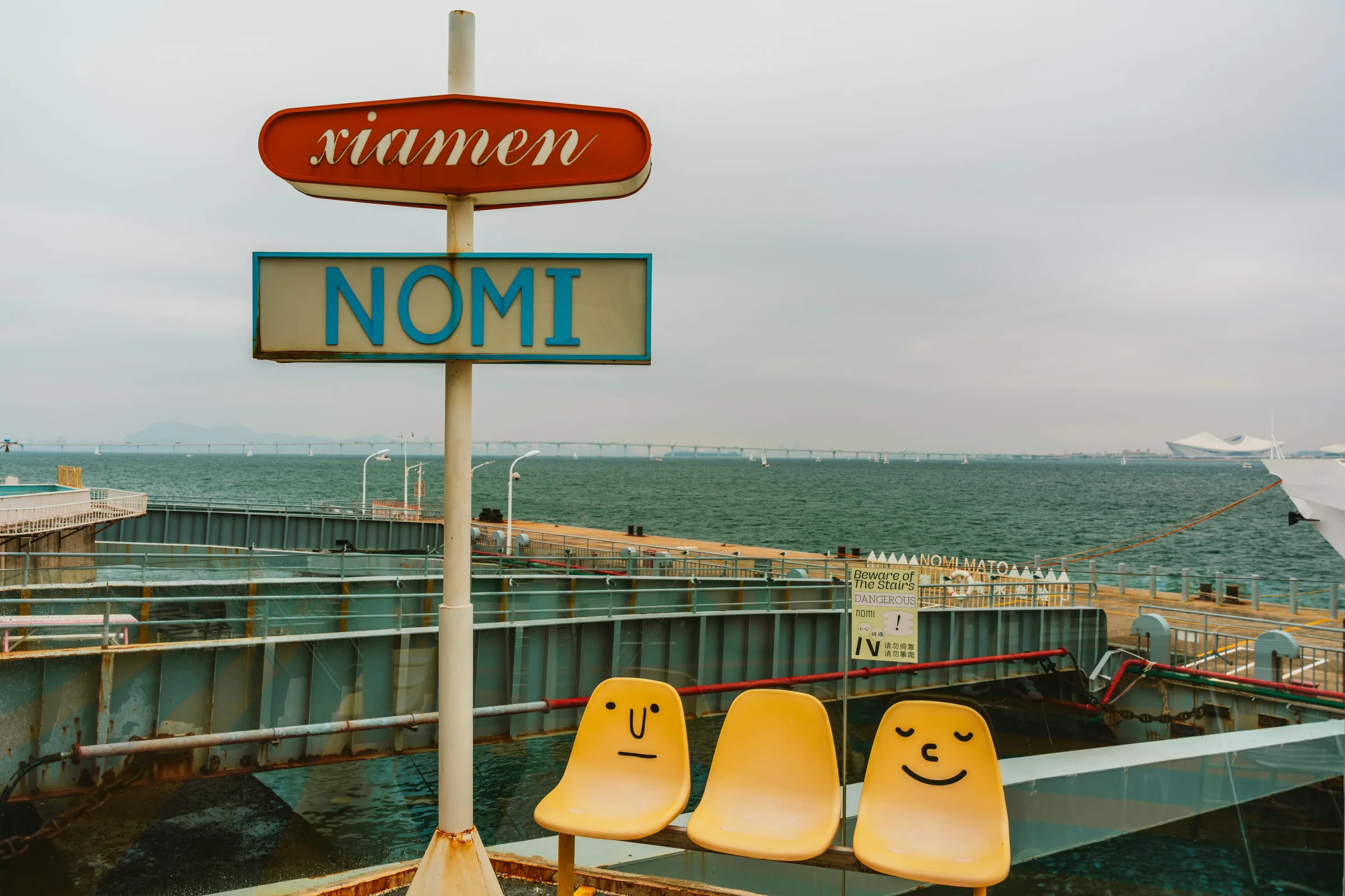Coastal skyline of Xiamen, China glowing at sunset