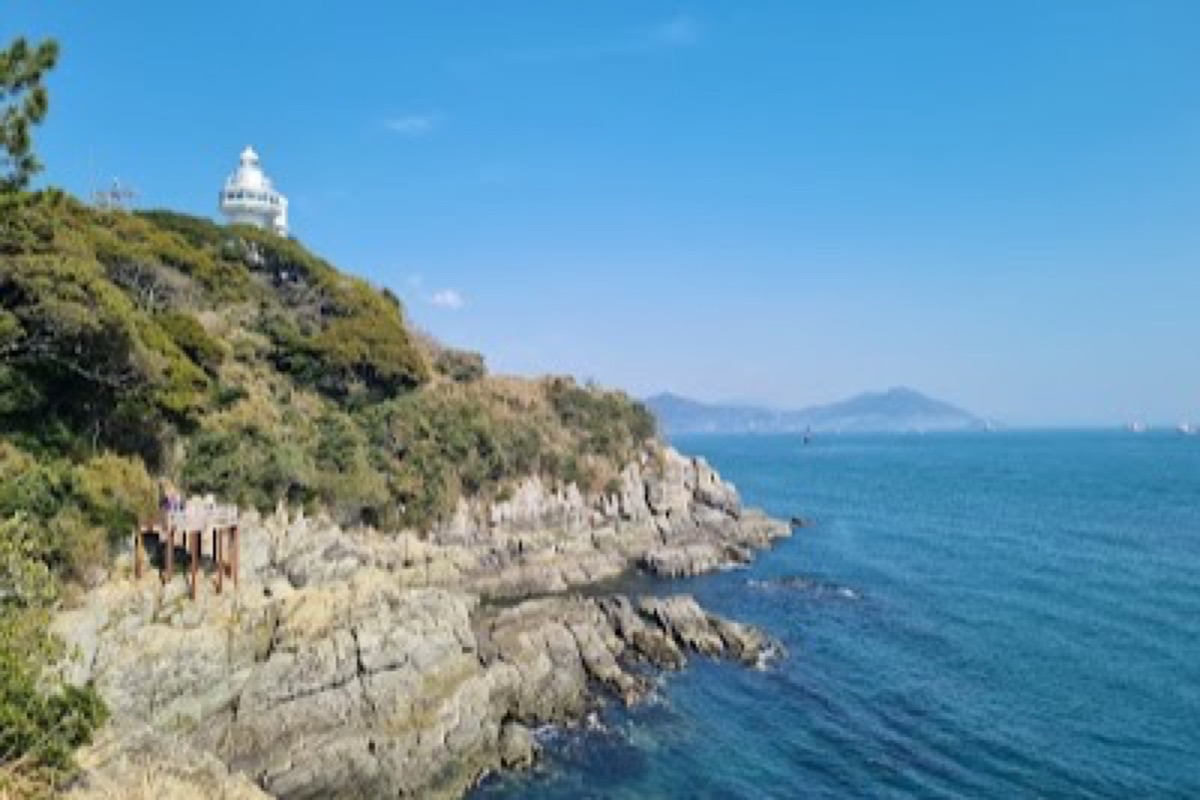 Odongdo Island coastal walking path with camellia groves and lighthouse at the southern tip of Yeosu harbor