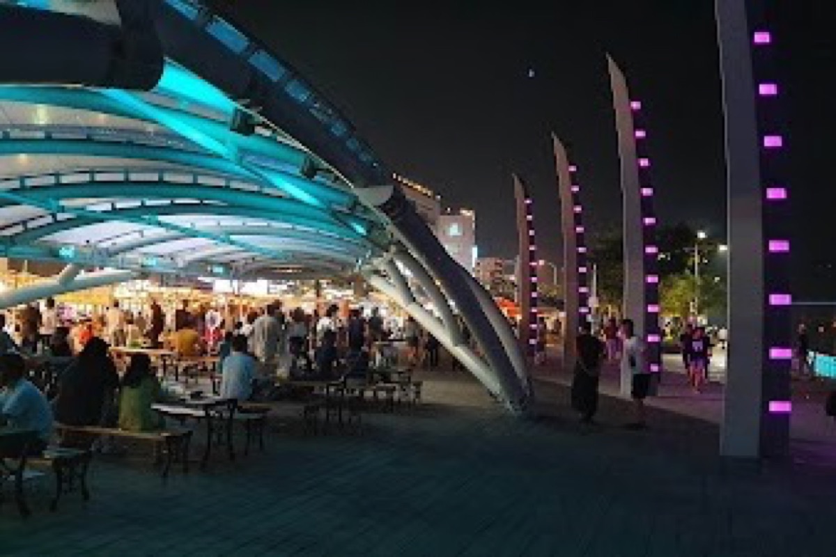 Yeosu Nangman Pocha Geori tent-restaurant street with grilled seafood stalls lit up at night