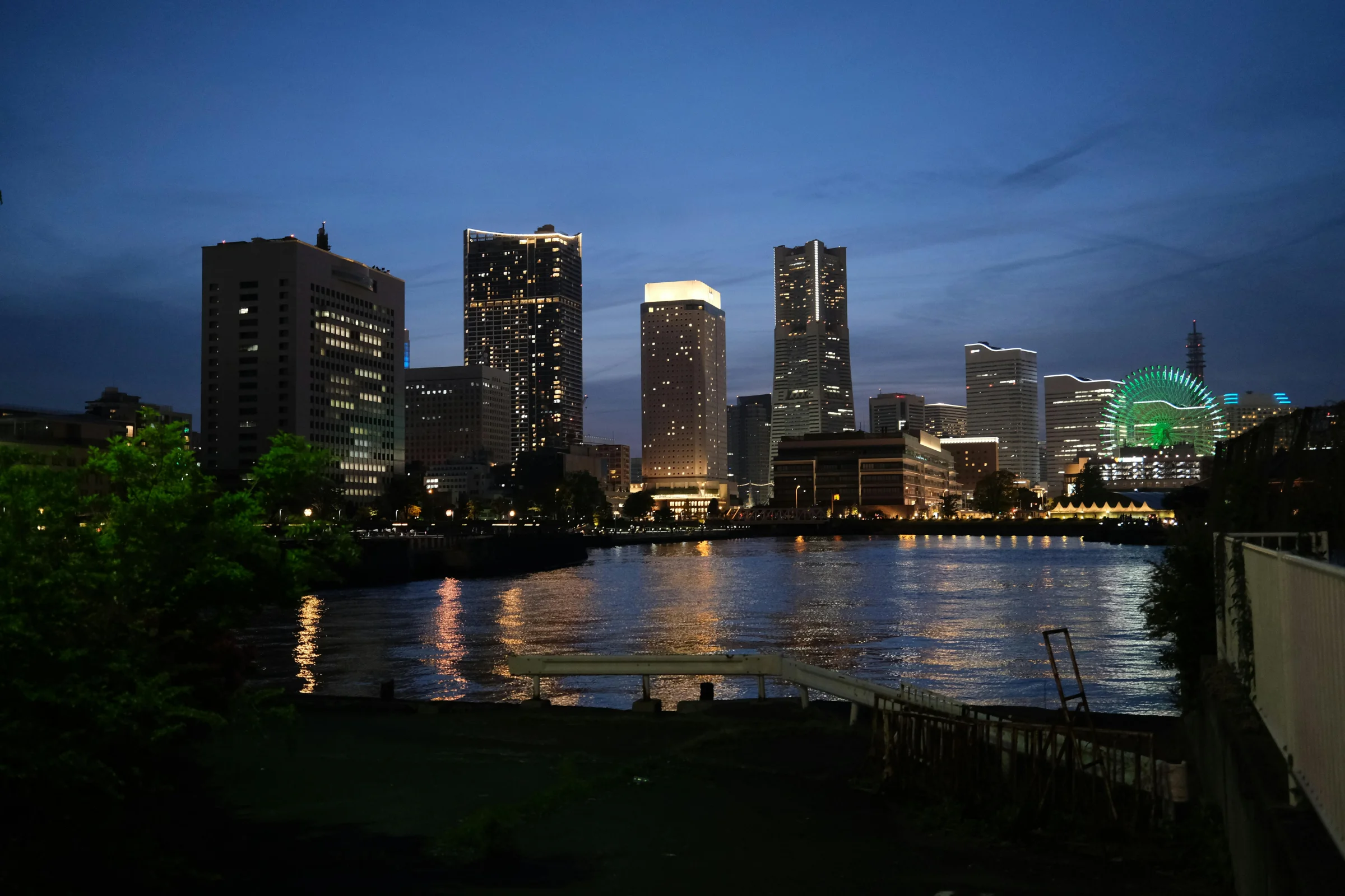 Yokohama Minato Mirai skyline reflecting on the waterfront at night