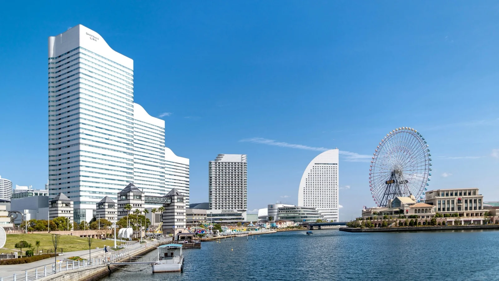 Yokohama waterfront skyline at dusk with Landmark Tower and bay bridge lights