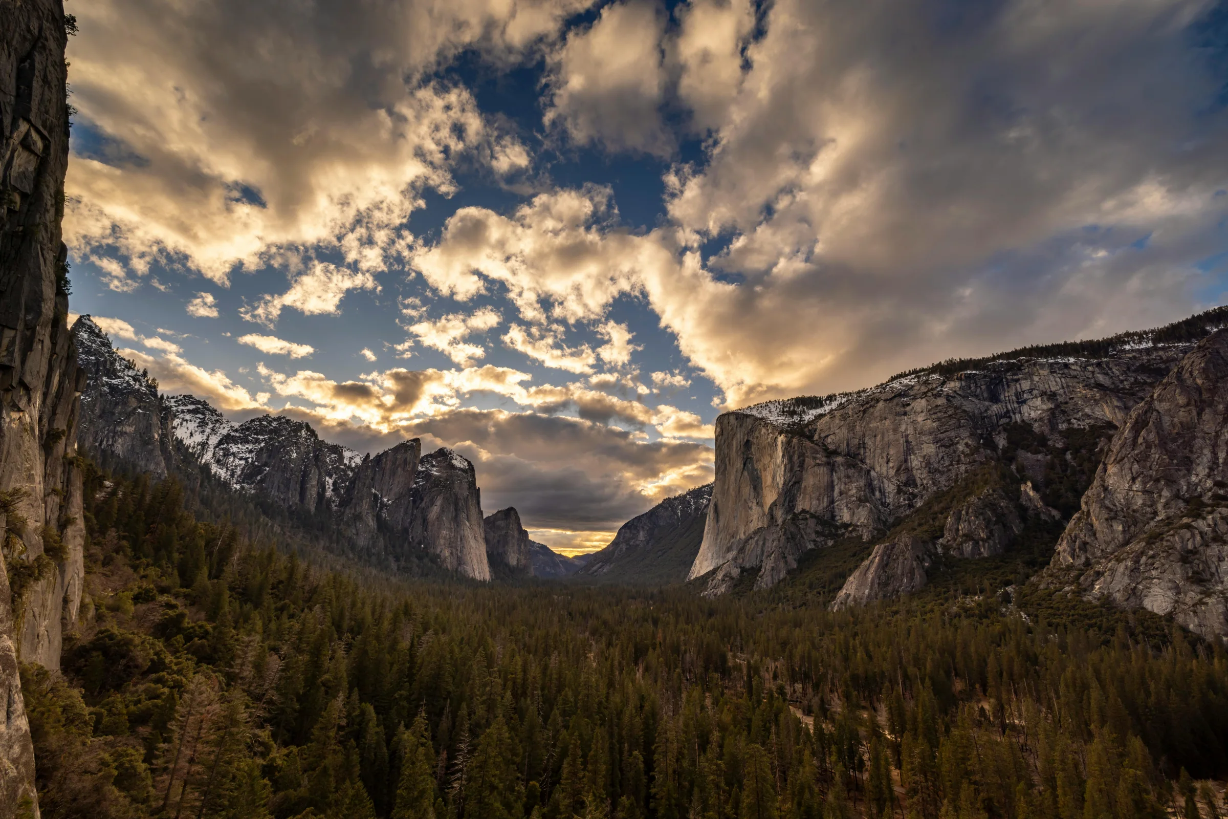 Sunrise view of Yosemite Valley with El Capitan and surrounding granite cliffs