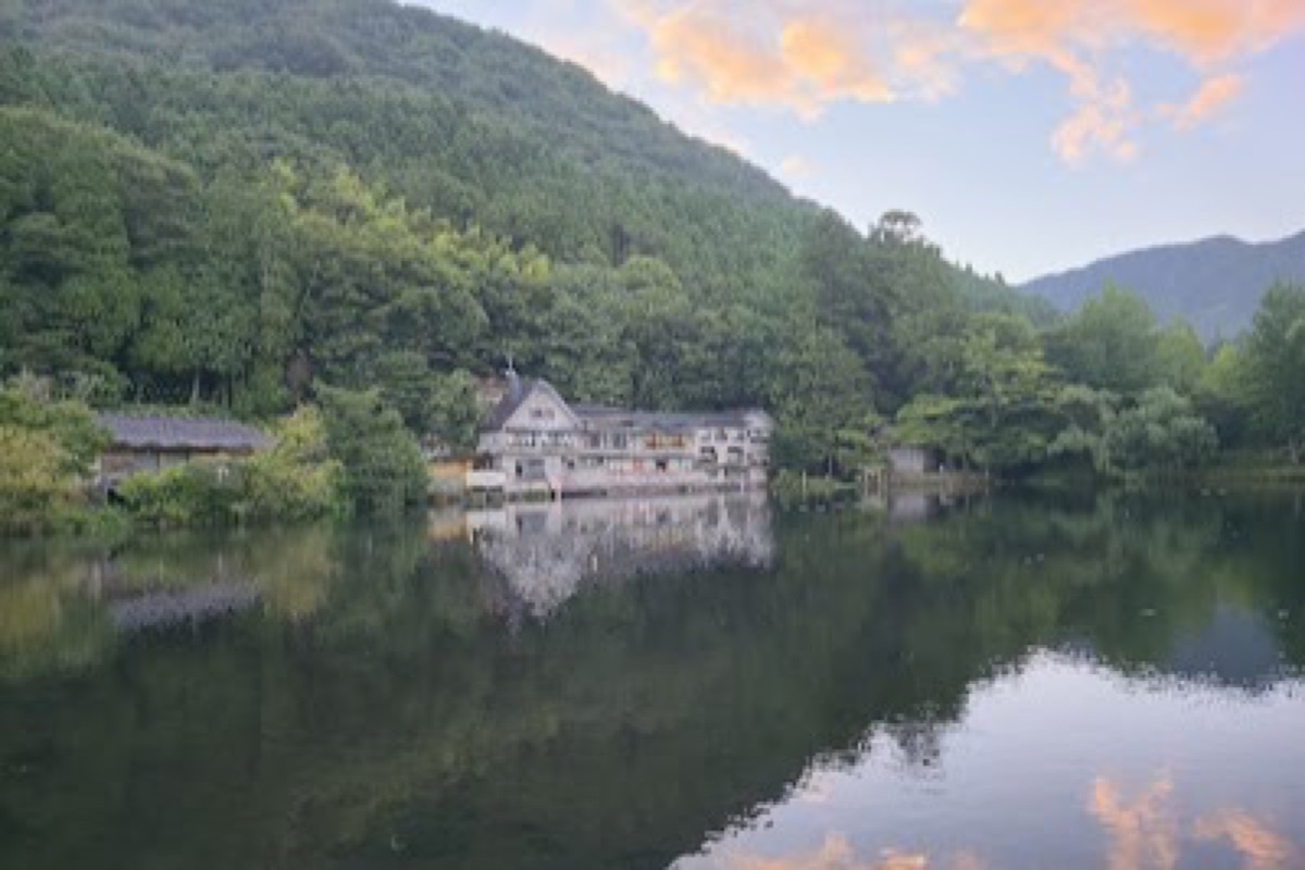 Lake Kinrinko with mist rising from thermal springs at dusk in Yufuin